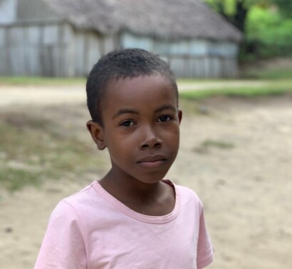 Schoolboy in front of building Madagascar