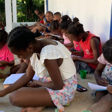 Group of children painting in afterschool programme Ile Sainte Marie, Madagascar