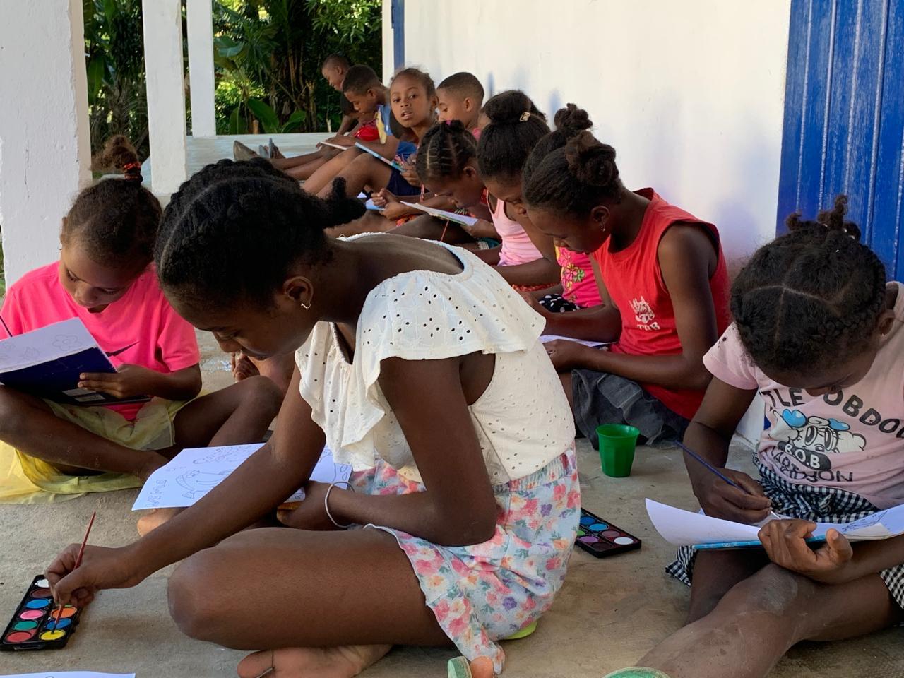 Group of children painting in afterschool programme Ile Sainte Marie, Madagascar