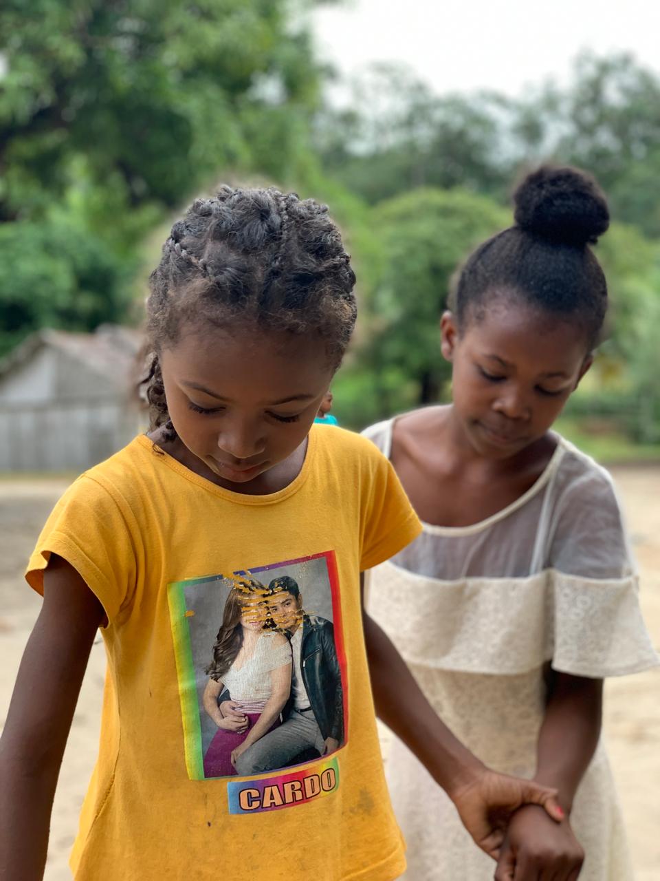 two girls playing in the school yard Ile Sainet Marie Madagascar