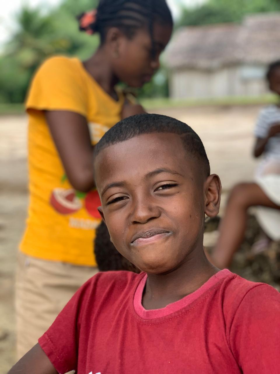 Smiling boy in school east coast Ile Sainte Marie Madagascar
