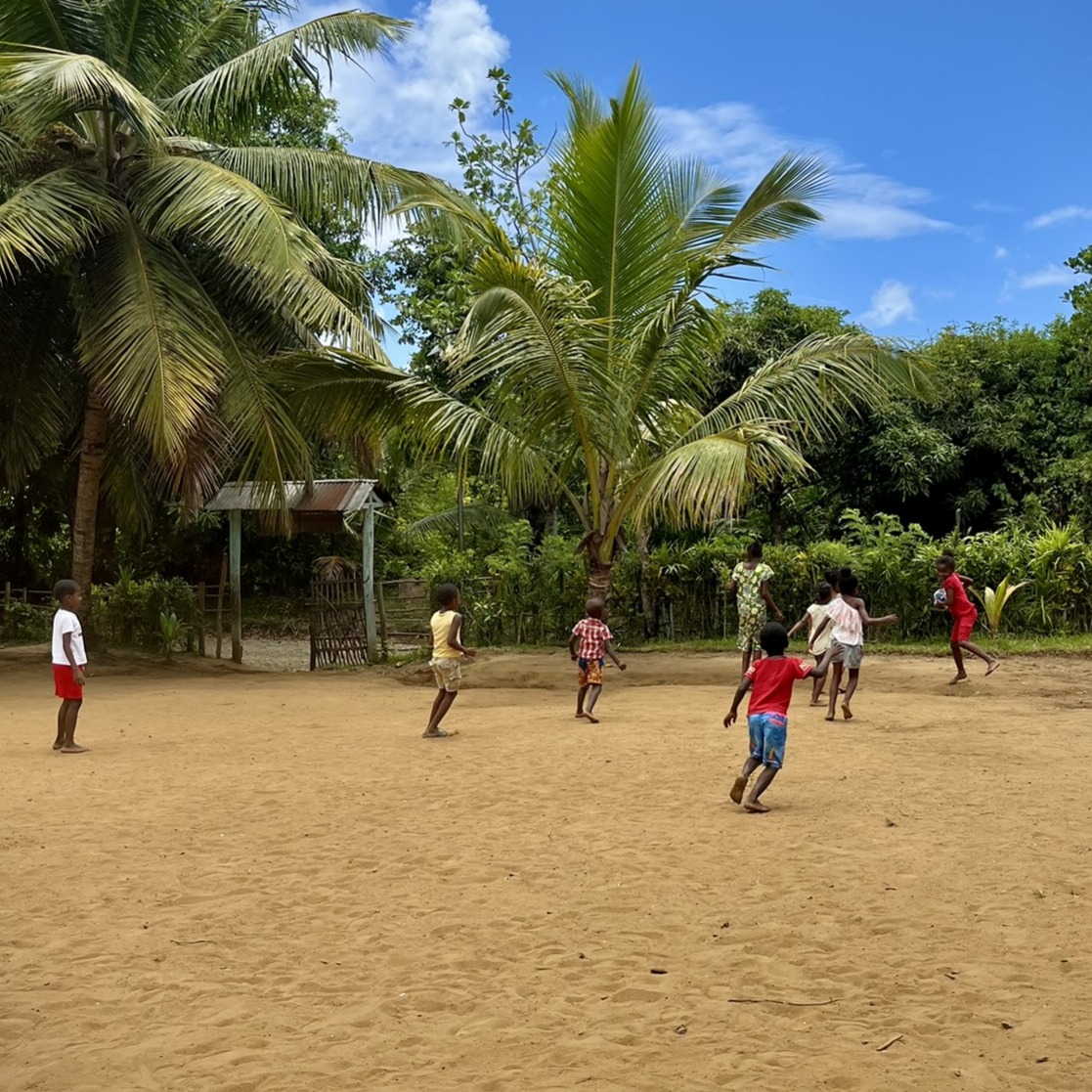Group of children playing ball Ile Sainte Marie, Madagascar