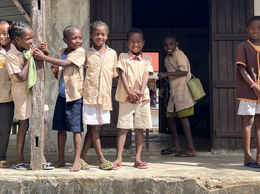 Schoolkids in uniform outside the school Ile Sainte Marie Madagascar