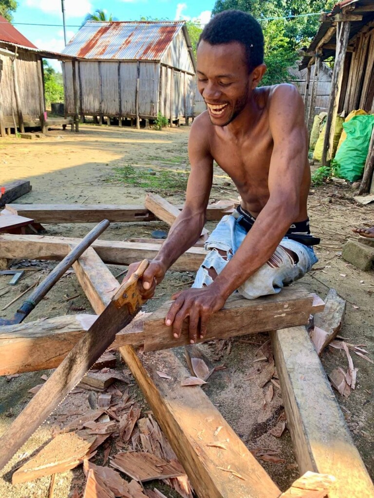 Local craftsman preparing the structure for a hut, Ile Sainte Marie Madagascar