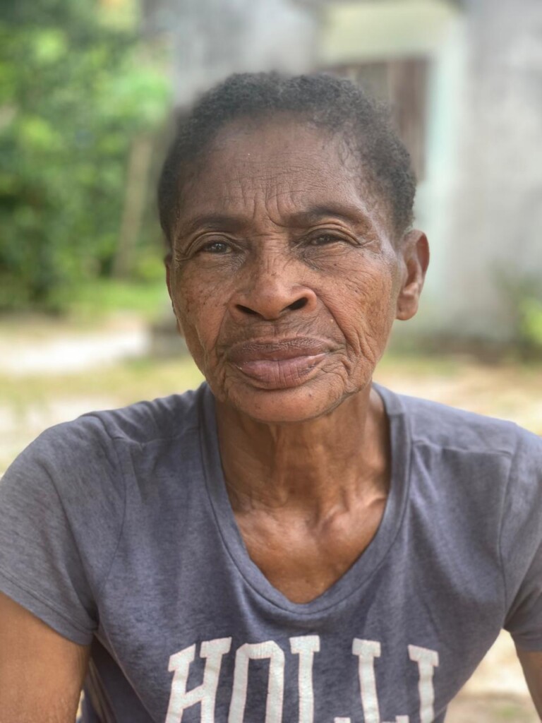 Madagascar older woman portrait. She is voluenteering for the canteen. Ile Sainte Marie