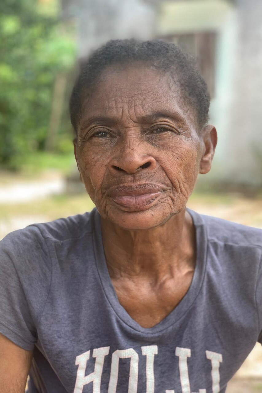 Madagascar older woman portrait. She is voluenteering for the canteen. Ile Sainte Marie