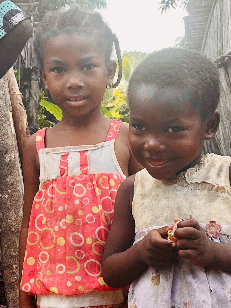 Two small girls in a poor village in Madagascar