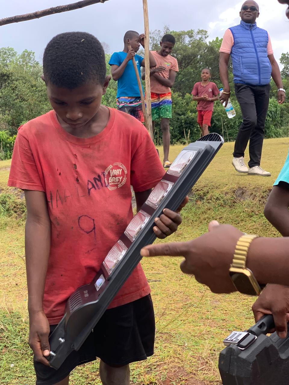 Installing solar lights in the village of Ambohidena