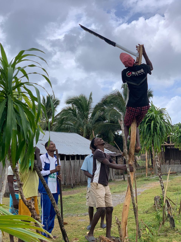 Installing solar lights in the village of Ambohidena