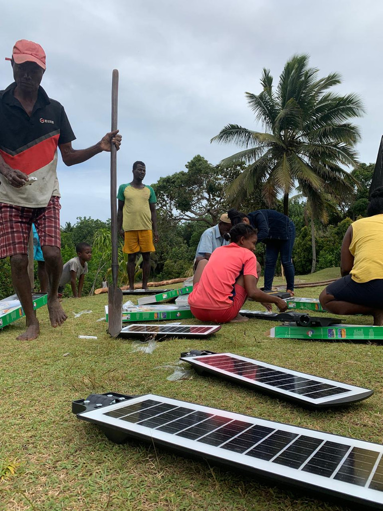 Installing solar lights in Ambohidena