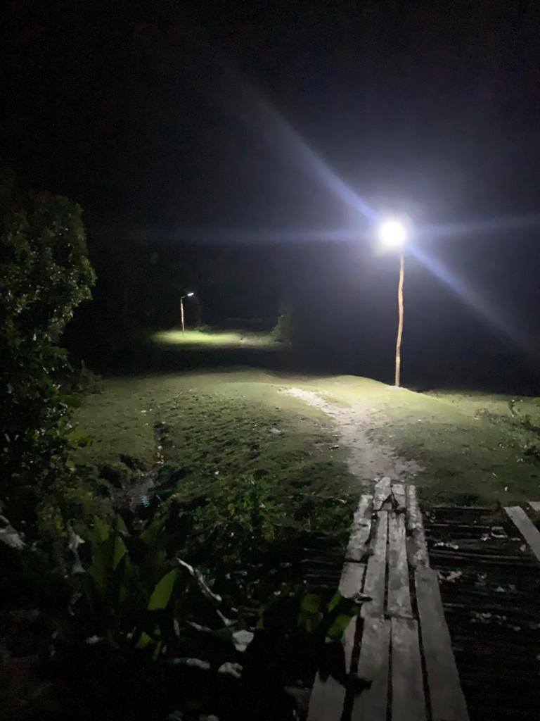 Installing solar lights in the village of Ambohidena